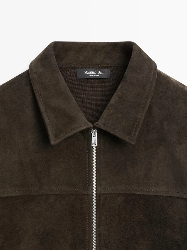 Contrasterend katoenen en leren jasje Contrasterend katoenen en leren jasje