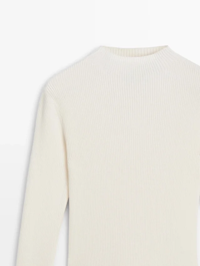 Gebreide jurk met bijpassende details Gebreide jurk met bijpassende details