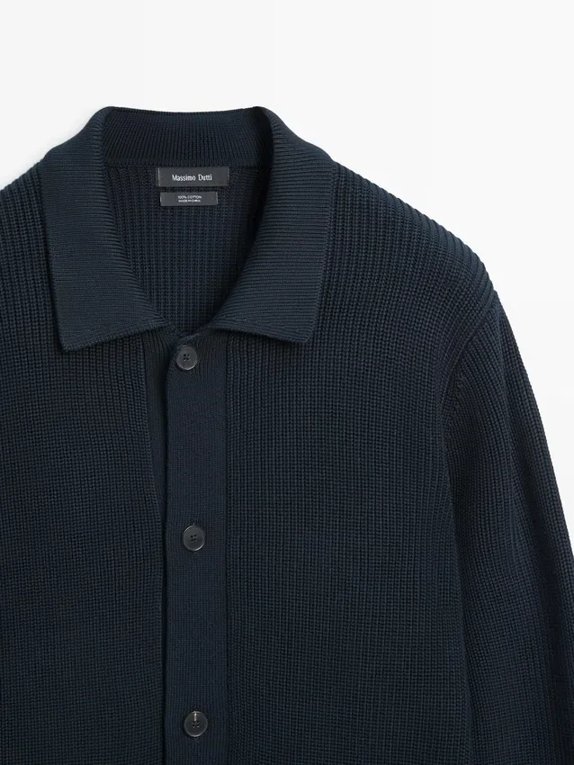 Katoenen gebreide Vesttrui met zakken Katoenen gebreide Vesttrui met zakken