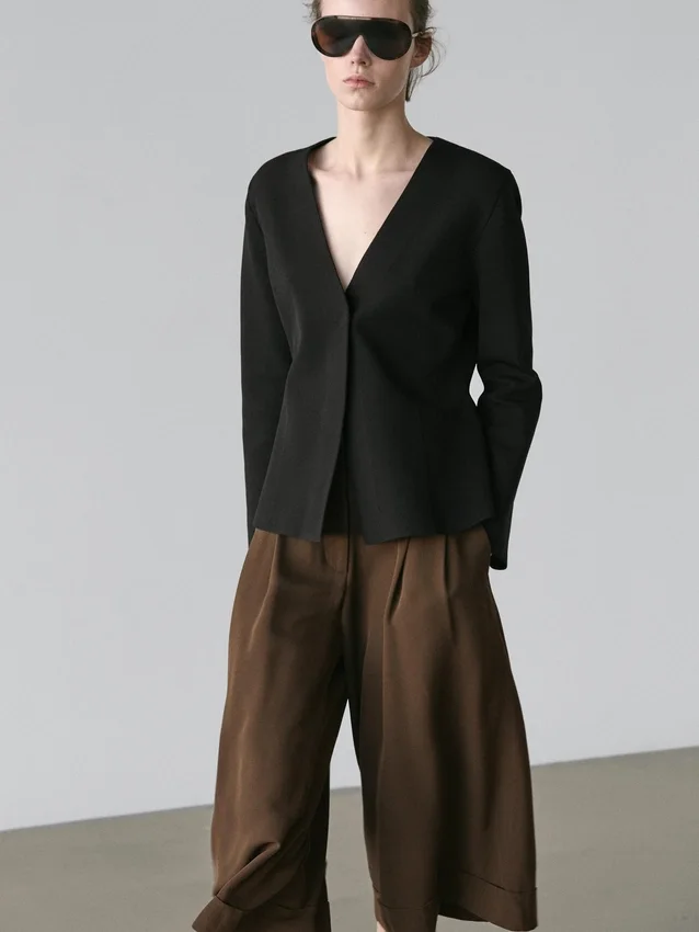 Lange bermuda met omgeslagen zomen Lange bermuda met omgeslagen zomen