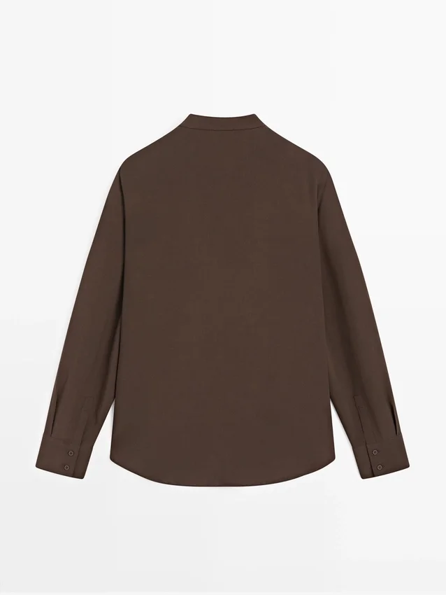 Soepelvallende blouse met ruches Soepelvallende blouse met ruches