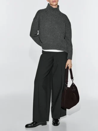 Tas van gespleten suède met oogjes