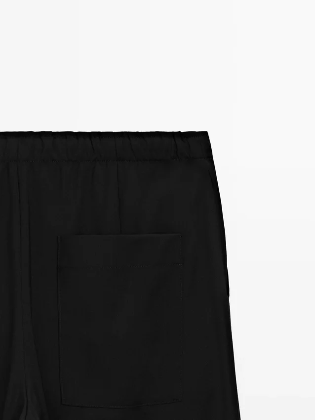 Wollen sarouelbroek met strikdetail Wollen sarouelbroek met strikdetail