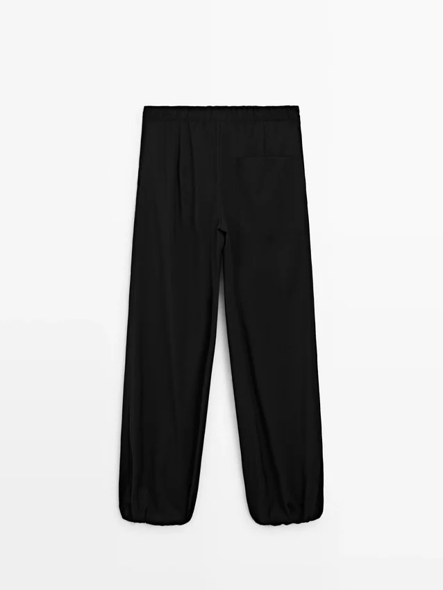 Wollen sarouelbroek met strikdetail Wollen sarouelbroek met strikdetail